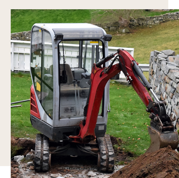 Workman excavate a hole in the garden