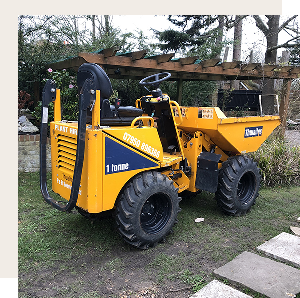 mini digger parked in the garden.